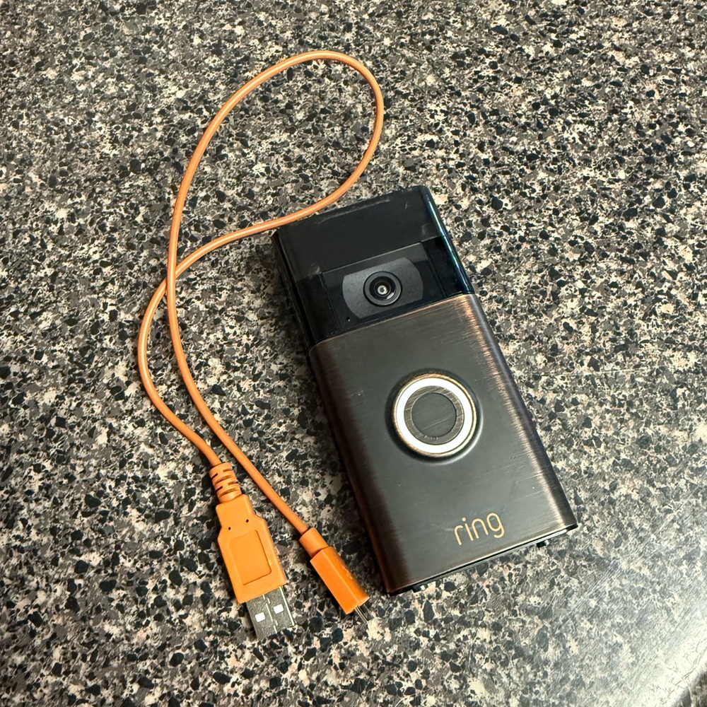 Ring Doorbell with Black Finish and Orange USB Cord